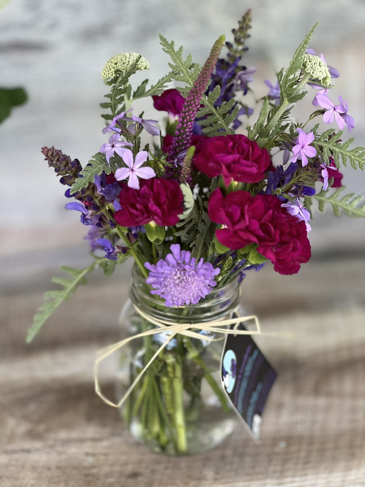 Spring bouquet in burgundy and lilac