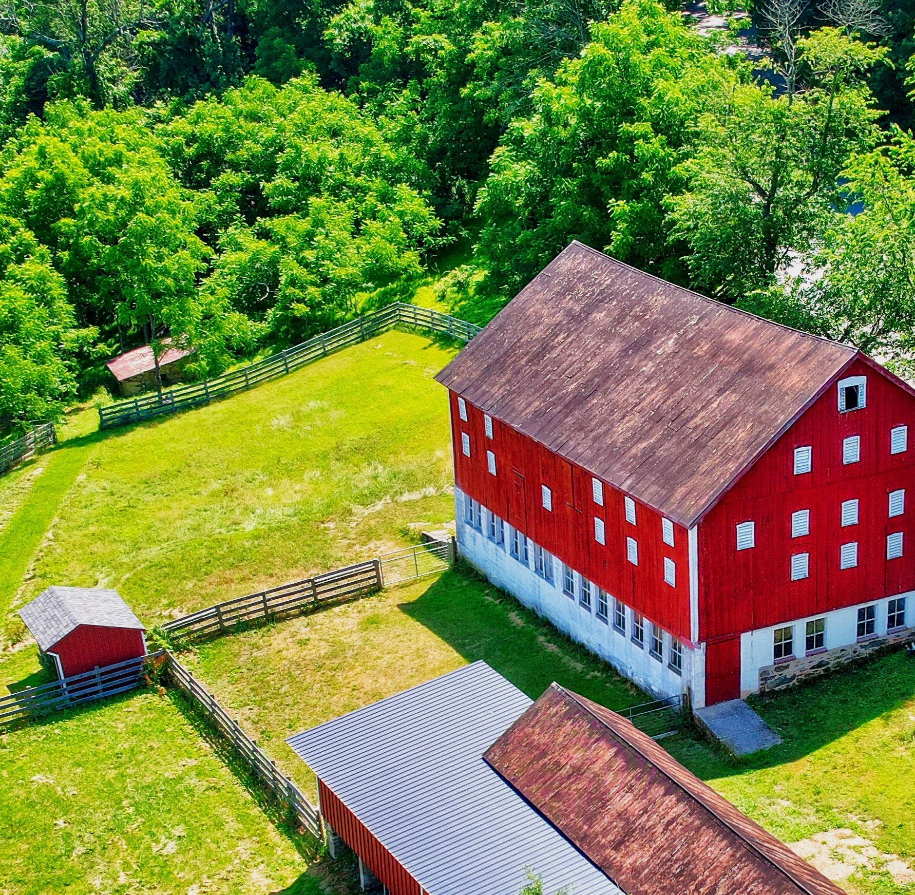 Exterior of the historic bank barn at Nuthatch Gardens